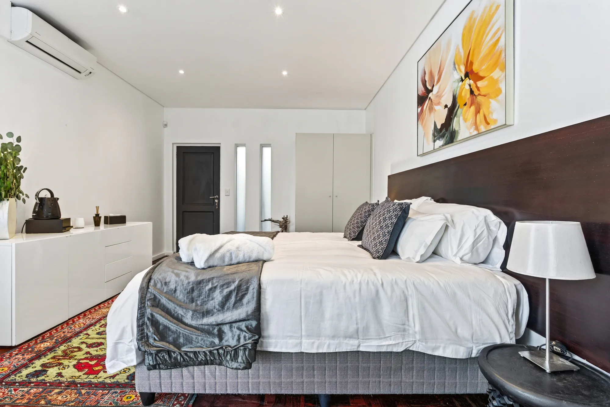 A wide view of a Casa Dias bedroom with floral artwork